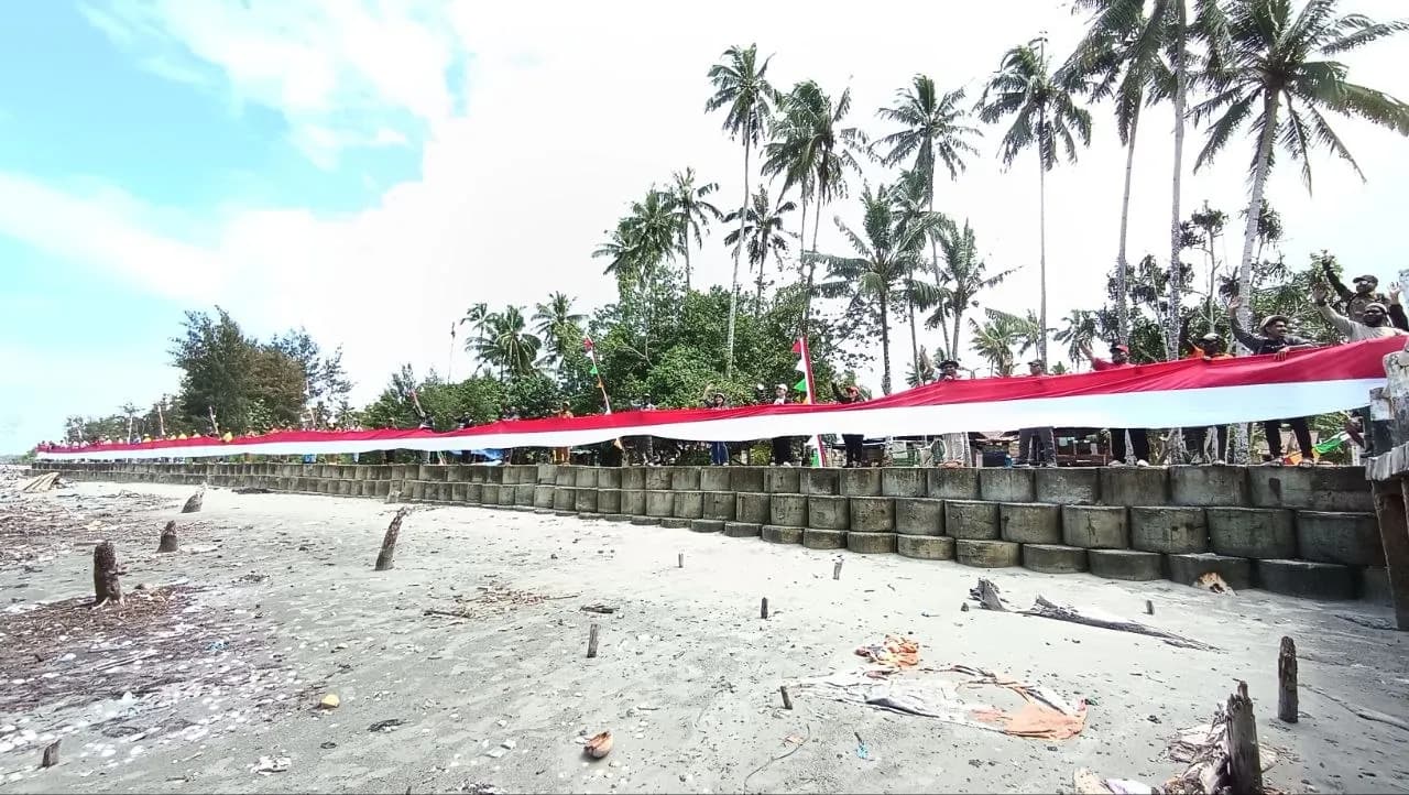 Ilustrasi berita Mimika: Pemkab Mimika Bentangkan Bendera Merah Putih Sepanjang 1 Kilometer di Pantai Amar