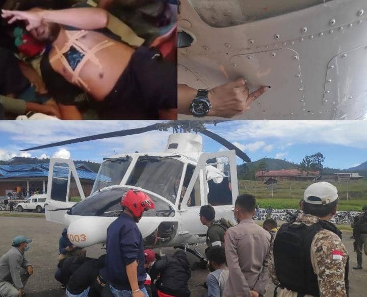 Korban sedang ditangani serta helikopter yang ikut ditembak
