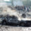 Puing-puing mobil tentara yang terbakar di lokasi ledakan di Jalalabad, Afghanistan