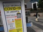 Papan informasi Covid-19 di Jakarta
